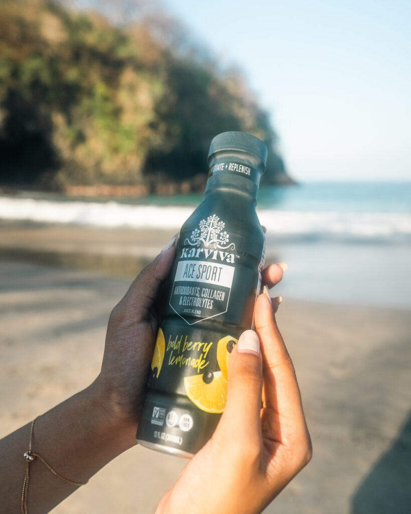 vertical-shot-person-holding-glass-wine-vineyard-sunlight 1