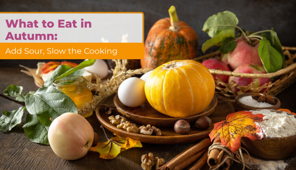 Autumn ingredients with pumpkins, apples, eggs, flour, and spices